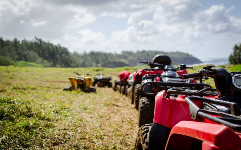 Shelby Auto Transport truck arriving at an outdoor ATV event